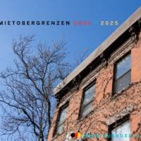 Bürgergeld: Neue Mietgrenzen – Das müssen Betroffene wissen 5 Blick auf Häuserfront und blauen Himmel