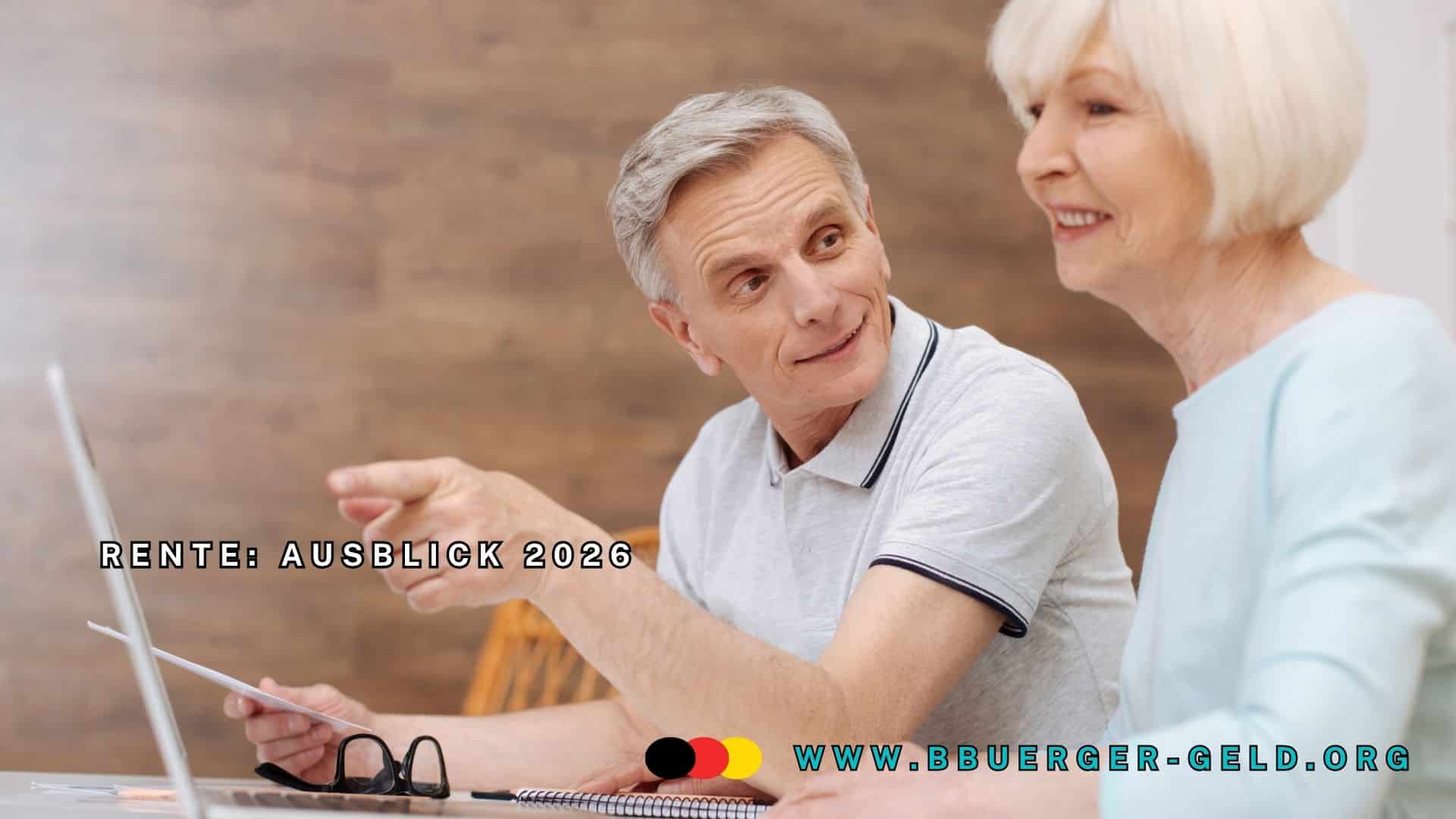 Rentner erklärt Seniorin etwas am Notebook und zeigt mit dem Finger nach vorn