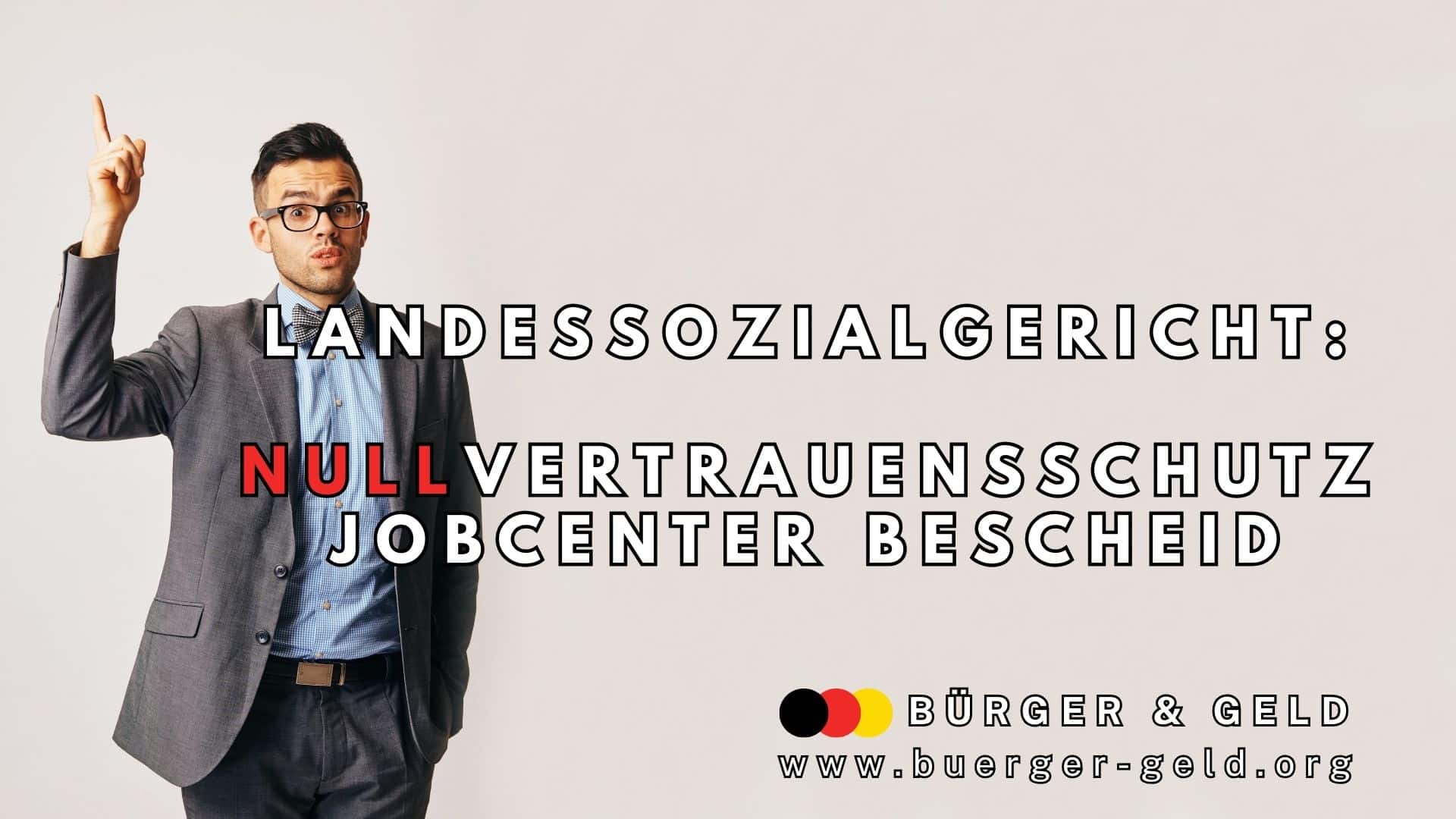 Mann im Anzug mit erhobenen Zeigewfinger