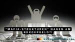 Scherenschnitt mit dunklen Gestalten
