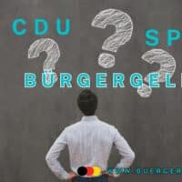 Mann mit Rücken zur Kamera schaut auf Fragezeichen: SPD, CDU, Bürgergeld